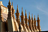 Vientiane, Laos - Surrounded by a cluster of pointed minor stupas the huge Pha That Luang shined under the warm light of the sunset. 